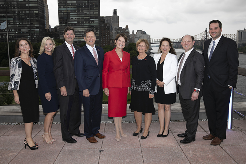 Members of the Culverhouse, including Dean Kay Palan and Board of Visitors member Phil Smith standing with Marillyn A. Hewson