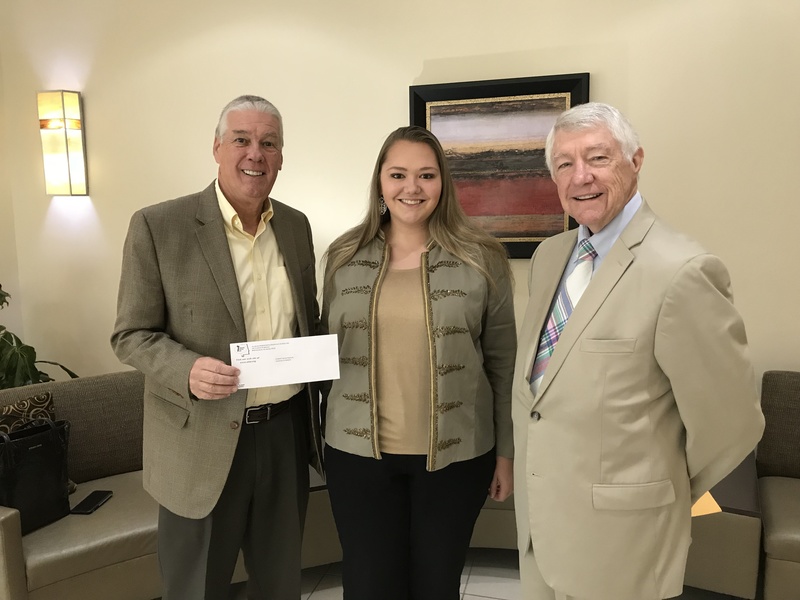 Elizabeth Peplinski pictured with her scholarship check