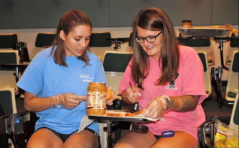 MIS220 students prepare a PB&J