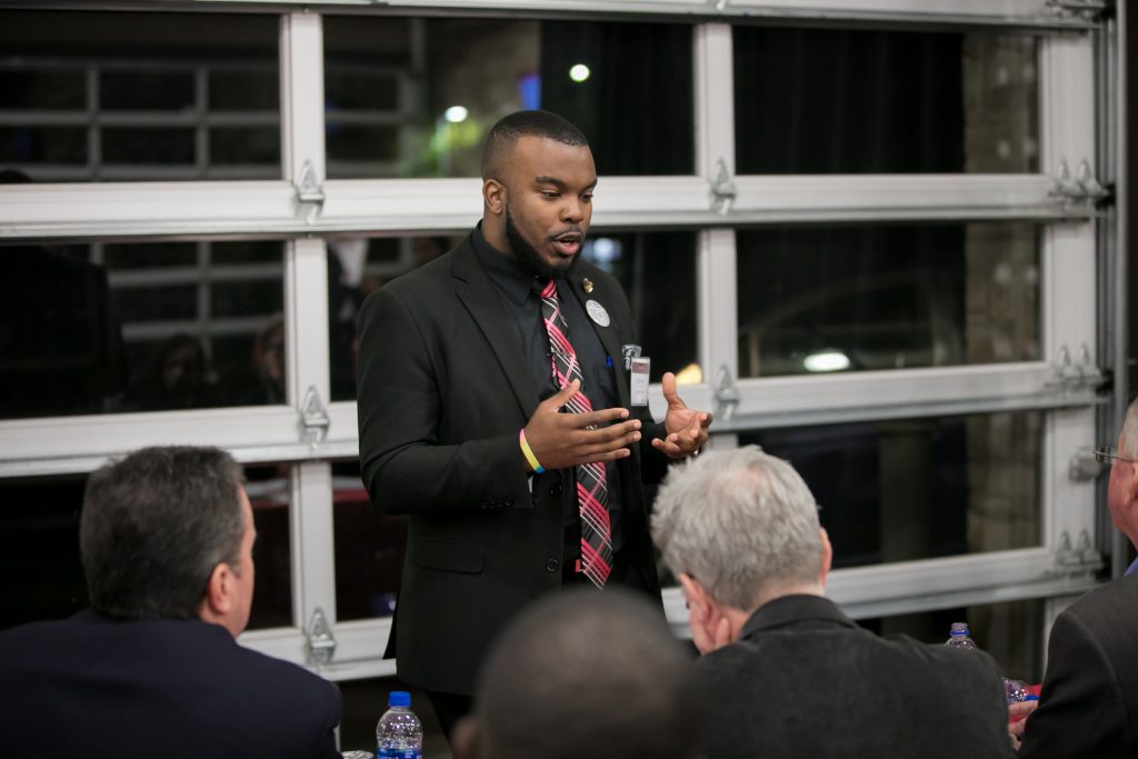 an entrepreneur pitching his idea at the River Pitch Competition