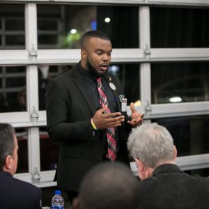 an entrepreneur pitching his idea at the River Pitch Competition