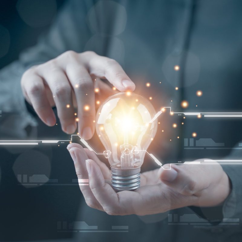 Hand with a light bulb. The idea of ​​inspiration from online technology. innovation idea concept. 
Success business solution, creative and brainstorm symbol by glowing light. Knowledge aspiration.