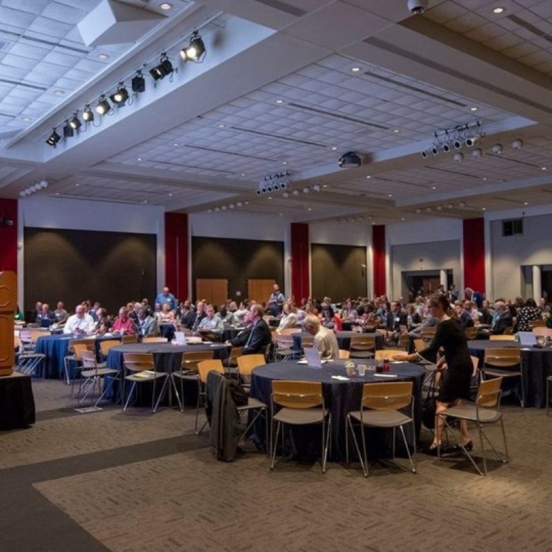 a speaker at a conference in the Bryant Conference Center